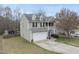 Aerial view of a two-story home with a two-car garage and a balcony on the front at 416 Collinsworth Dr, Clayton, NC 27527