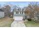 Charming two-story home with a two-car garage and a balcony on the front at 416 Collinsworth Dr, Clayton, NC 27527