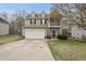 Charming two-story home with a two-car garage and a balcony on the front at 416 Collinsworth Dr, Clayton, NC 27527