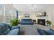 Inviting living room with fireplace, large window, and comfortable seating arrangement at 416 Collinsworth Dr, Clayton, NC 27527