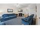 Cozy living room featuring a fireplace, a ceiling fan, and traditional furnishings at 416 Collinsworth Dr, Clayton, NC 27527