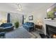 Bright living room boasts a fireplace, a large window, and comfortable seating at 416 Collinsworth Dr, Clayton, NC 27527