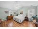 Light-filled bedroom with vaulted ceiling, ceiling fan and hardwood floors at 416 Collinsworth Dr, Clayton, NC 27527