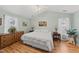 Bright bedroom featuring hardwood floors, vaulted ceiling and a ceiling fan at 416 Collinsworth Dr, Clayton, NC 27527