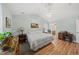 Cozy bedroom featuring light-blue walls, vaulted ceiling and an en-suite bathroom at 416 Collinsworth Dr, Clayton, NC 27527