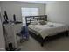 Primary bedroom featuring a large bed and workspace at 4502 Pale Moss Dr, Raleigh, NC 27606