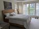 Comfortable bedroom with a large window that lets in natural light with art on the wall at 4502 Pale Moss Dr, Raleigh, NC 27606