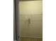 Open closet with shelves, hanging rod, and one towel at 4502 Pale Moss Dr, Raleigh, NC 27606