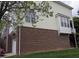 This townhome features a mix of brick and siding, complemented by multiple windows for natural light and rear balcony at 4502 Pale Moss Dr, Raleigh, NC 27606