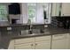 This kitchen features a functional layout with an open view to living area with access to the back patio at 4502 Pale Moss Dr, Raleigh, NC 27606