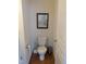 A half bath featuring a toilet and tasteful decor at 4502 Pale Moss Dr, Raleigh, NC 27606