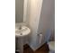 Modest powder room features a toilet and small pedestal sink at 4502 Pale Moss Dr, Raleigh, NC 27606