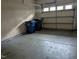 Spacious garage with ample room for parking and storage, featuring a roll-up door at 4502 Pale Moss Dr, Raleigh, NC 27606