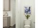 Elegant half-bathroom featuring modern fixtures, stylish decor, and a clean, inviting space at 525 Morning Light Dr # 31, Angier, NC 27501