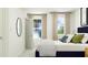 Well-lit bedroom with neutral colors, accent pillows, and lots of sunlight at 525 Morning Light Dr # 31, Angier, NC 27501