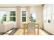 Open-concept dining area with hardwood floors, natural light, and elegant furniture, ideal for entertaining at 525 Morning Light Dr # 31, Angier, NC 27501