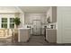 Open kitchen with gray cabinets, stainless steel appliances, and a spacious island perfect for modern living at 525 Morning Light Dr # 31, Angier, NC 27501