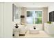 Bright living room featuring neutral furniture, a TV, and large windows at 525 Morning Light Dr # 31, Angier, NC 27501