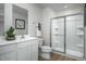 Clean bathroom with modern fixtures, white cabinetry, and a glass-enclosed shower for a fresh feel at 62 Furley St, Sanford, NC 27330