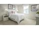 Charming bedroom with light color scheme, decorative wall art, and a cozy atmosphere at 62 Furley St, Sanford, NC 27330