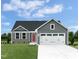 Charming single-Gathering home featuring a well-maintained lawn and a two-car garage at 62 Furley St, Sanford, NC 27330
