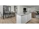 Open-concept kitchen with a granite island and view of the dining area at 62 Furley St, Sanford, NC 27330