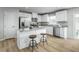 Modern kitchen featuring stainless steel appliances, a kitchen island with seating at 62 Furley St, Sanford, NC 27330