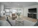 Comfortable living room with an open layout to the kitchen and dining areas at 62 Furley St, Sanford, NC 27330