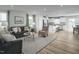 Open-concept living space with modern decor, seamlessly connecting the kitchen and living areas at 62 Furley St, Sanford, NC 27330