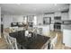 Spacious living area with an open layout connecting the kitchen, dining, and Gathering rooms at 62 Furley St, Sanford, NC 27330