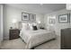 Comfortable primary bedroom with ensuite bathroom, neutral tones and ample natural light at 62 Furley St, Sanford, NC 27330