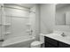 A well-lit bathroom with a shower-tub combo, toilet, and sleek vanity at 66 Furley St, Sanford, NC 27330