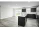 Bright kitchen with stainless steel appliances and a large island for meal prep or entertaining at 66 Furley St, Sanford, NC 27330
