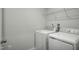 A dedicated laundry room with a side-by-side washer and dryer unit at 66 Furley St, Sanford, NC 27330