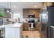 Charming kitchen with stainless steel appliances and breakfast bar at 6648 Woodlawn Dr, Oxford, NC 27565