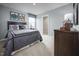 A cozy bedroom with a large bed, dresser, window, and themed decor at 700 Port Charlotte Ct, Sanford, NC 27330