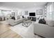 Open-concept living room with neutral tones, comfortable sofas, and contemporary decor at 700 Port Charlotte Ct, Sanford, NC 27330