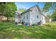 Well maintained backyard with green lawn and back porch at 726 Elizabeth Ave, Wake Forest, NC 27587