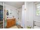 Bathroom with white cabinets, linoleum flooring, bathtub and shower at 726 Elizabeth Ave, Wake Forest, NC 27587