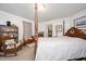 Bright bedroom with antique furniture, neutral carpet, and window at 726 Elizabeth Ave, Wake Forest, NC 27587