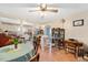 Bright dining area with hardwood floors and an open view into the kitchen at 726 Elizabeth Ave, Wake Forest, NC 27587