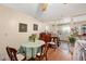 Cozy dining area with a round table, chairs, and hardwood floors, connected to an open kitchen at 726 Elizabeth Ave, Wake Forest, NC 27587