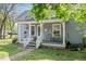 Charming home with a cozy front porch featuring comfortable seating and charming details at 726 Elizabeth Ave, Wake Forest, NC 27587