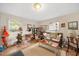 Cozy living room featuring large windows, comfortable seating, and plenty of natural light at 726 Elizabeth Ave, Wake Forest, NC 27587