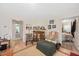 Bright living room with hardwood floors, comfortable seating, and a doorway to the Primary bedroom at 726 Elizabeth Ave, Wake Forest, NC 27587