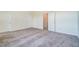 Spacious carpeted bedroom with open door to an ensuite bathroom at 743 Parc Townes Dr # 36, Wendell, NC 27591