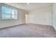 Bright carpeted bedroom with lots of natural light from large windows at 743 Parc Townes Dr # 36, Wendell, NC 27591