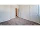 Bedroom with plush carpet and an open closet for easy storage at 743 Parc Townes Dr # 36, Wendell, NC 27591