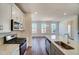 Well-equipped kitchen with stainless steel appliances, including a range and microwave, and subway tile backsplash at 743 Parc Townes Dr # 36, Wendell, NC 27591