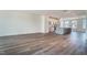 Spacious living room featuring hardwood floors, recessed lighting, and seamless flow to the kitchen area at 743 Parc Townes Dr # 36, Wendell, NC 27591